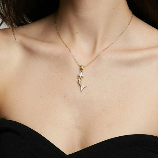 Dainty 9ct fish pendant gold skeleton design for women by Qutahia Jewellery