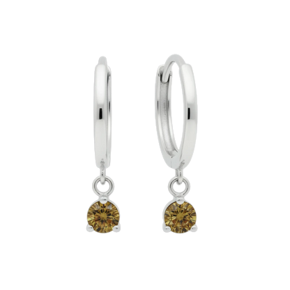 Qutahia Jewelry 14k solid gold dangling huggie earrings with claw-set yellow-green gemstones.