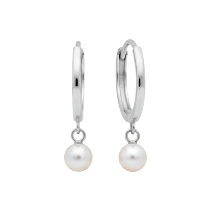 Qutahia Jewelry 14k solid gold huggie earrings with dangling pearl, claw-set solitaire.