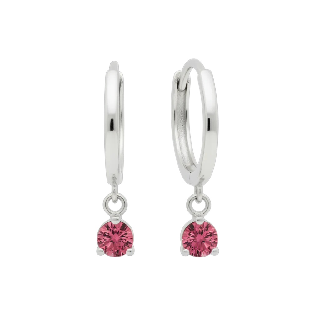 Qutahia Jewelry 14k solid gold dangling huggie earrings with pink gemstones in a claw setting.